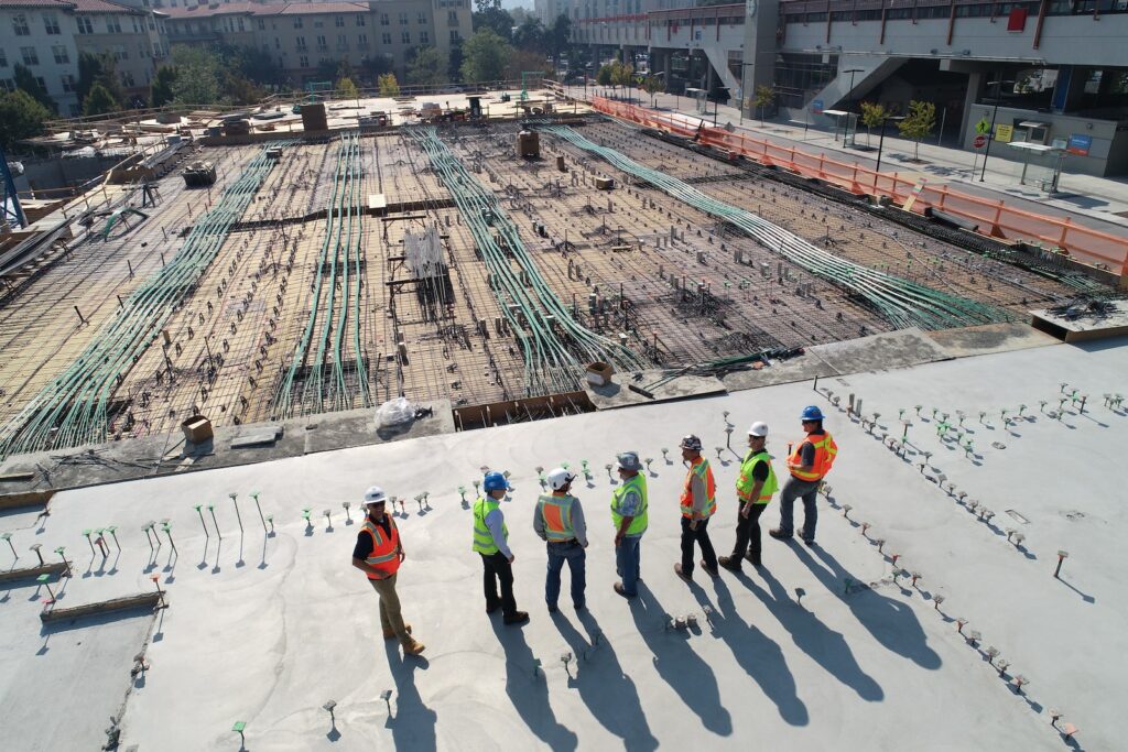 construction workers standing on a roof
